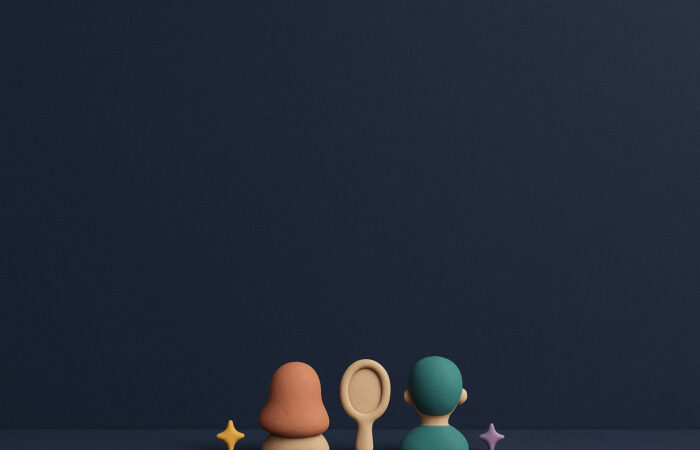 Ilustración 3D de plastilina con dos bustos estilizados y peinados diferentes a ambos lados de un espejo